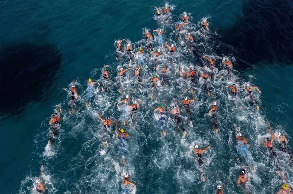 A group of swimmers competing in the Open Water Swimming World Cup in NEOM