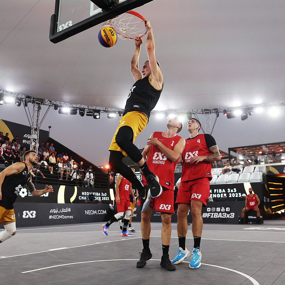 A group of athletes competing in a 3x3 basketball game in NEOM